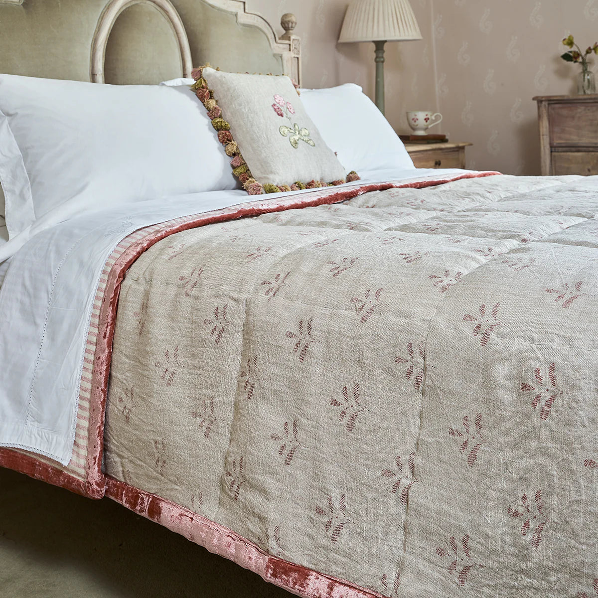 Red Leaf rustic linen quilt on a bed with white pillows