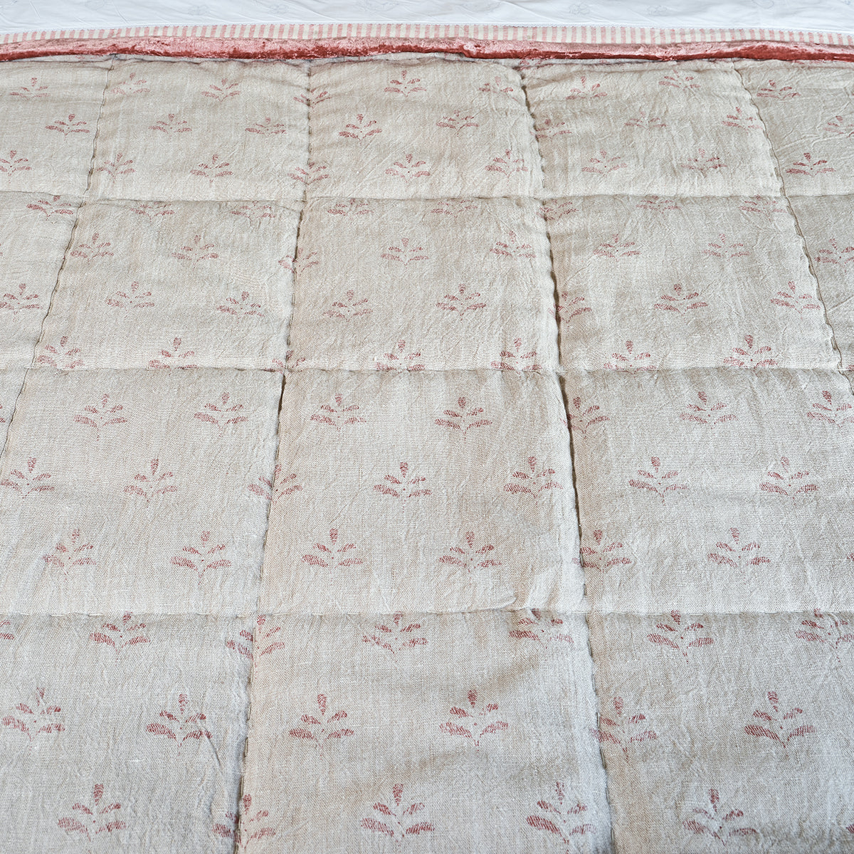 Red Leaf quilt laid flat showing the scattered printed sprigs