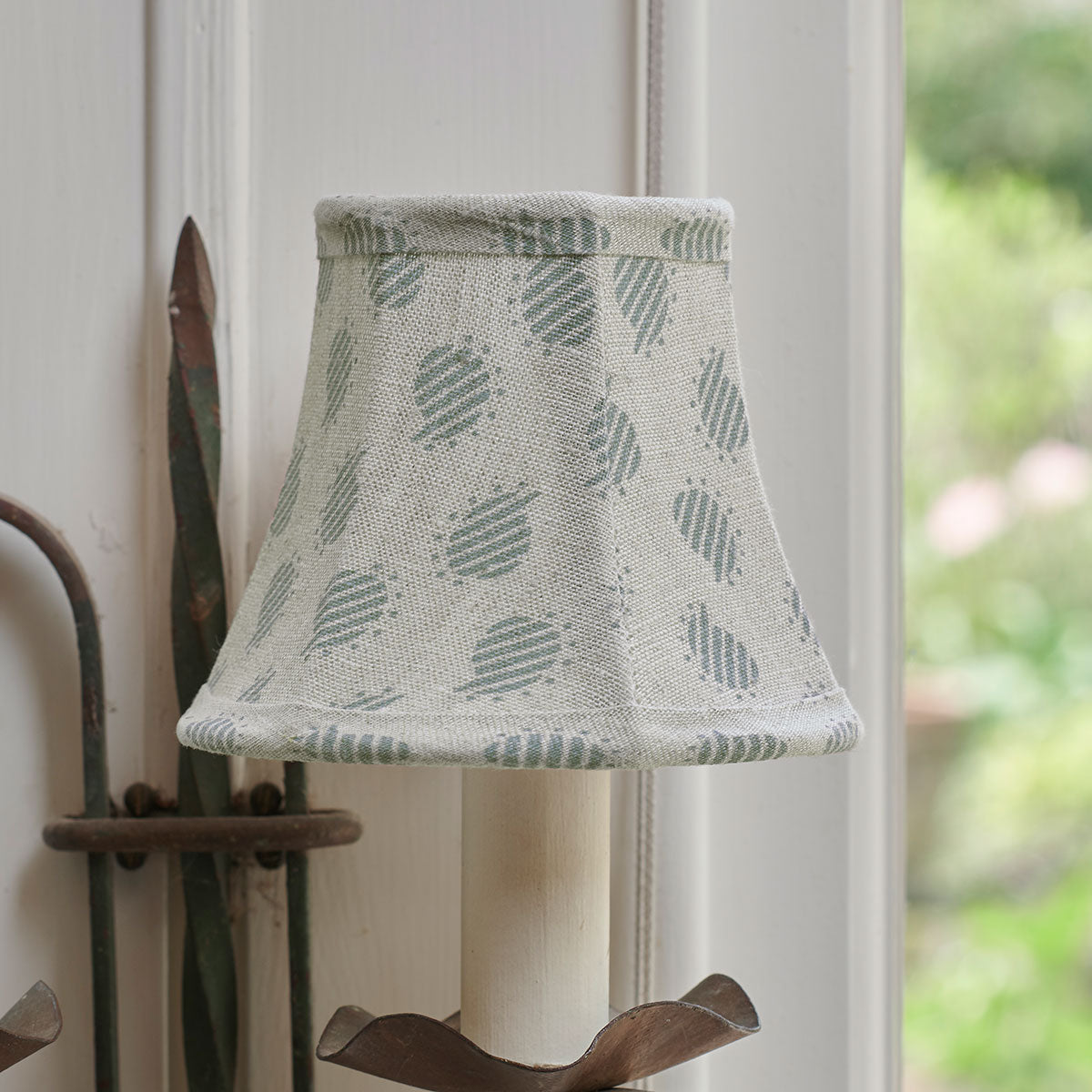 Blue Nina linen clip-on framed lampshade on a wall bracket, unlit