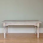 Gustavian dining table seen side on, showing its carved turned leg