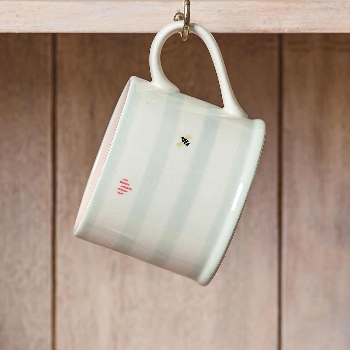 Honey Bees straight mug in green stripe hanging from a hook