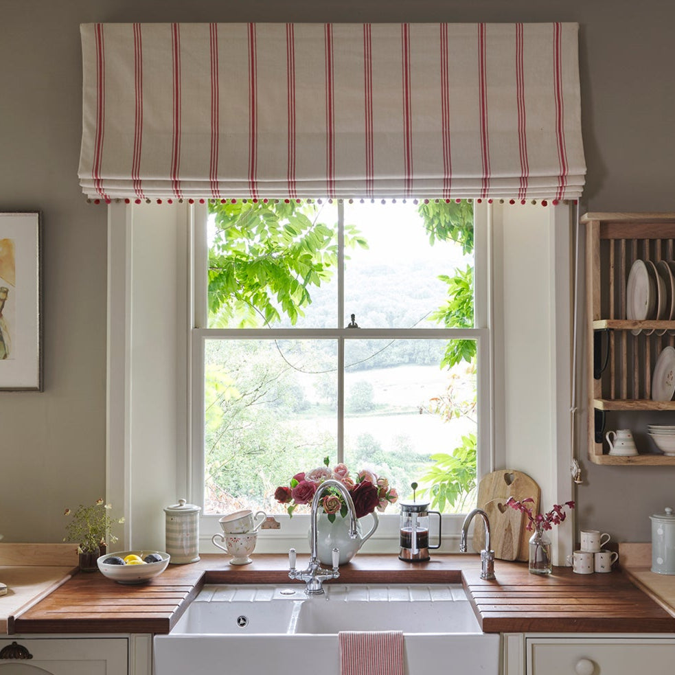 Kitchen window with an Ivory Rose stripe blind and matching curtains