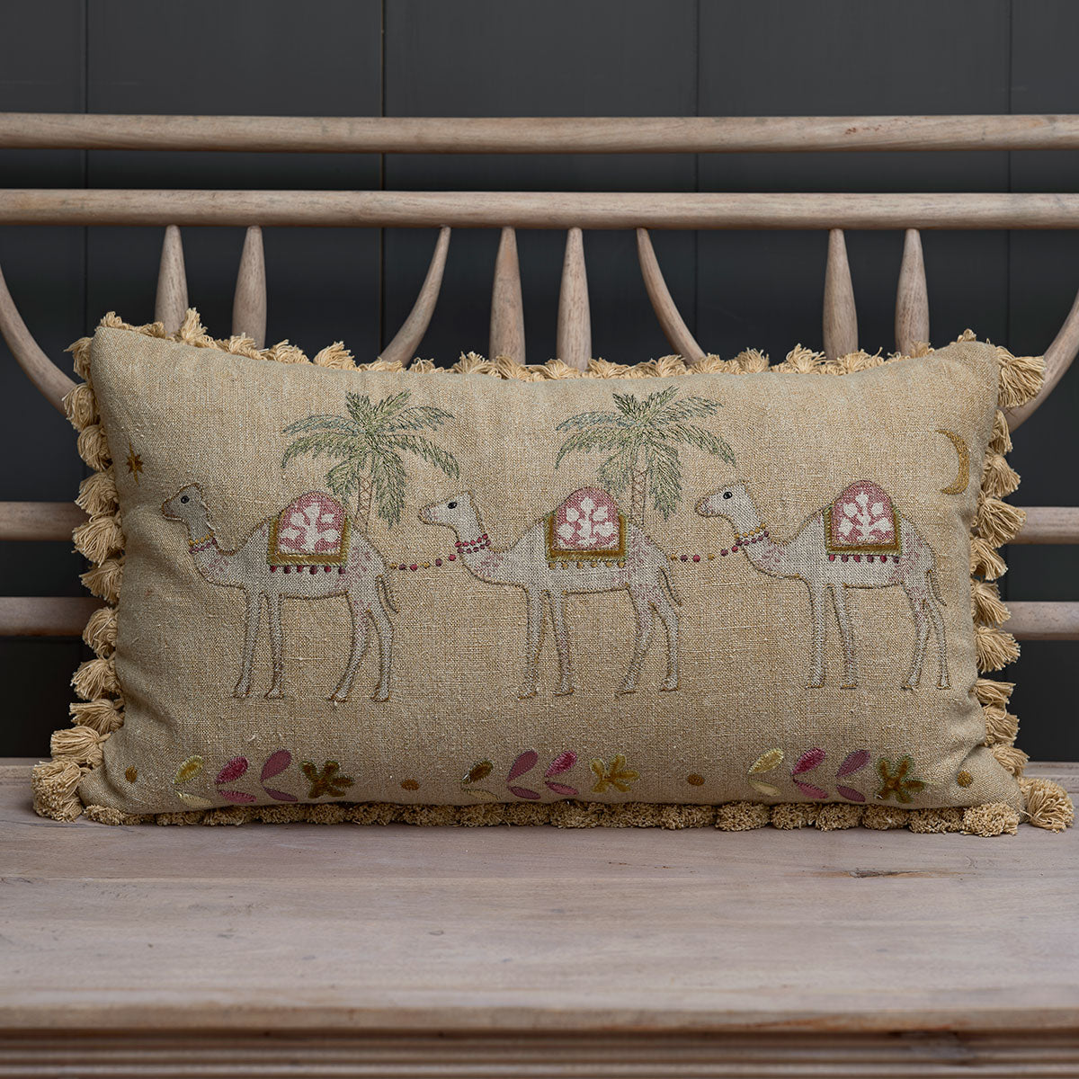 Golden Camels embroidered cushion on a painted bench, camels and palm trees