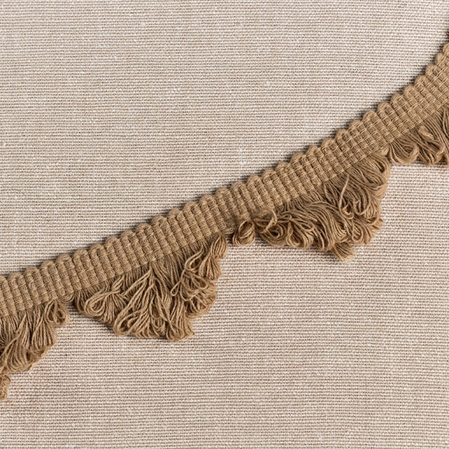 Close up view of the Beech fan edge trim on natural linen