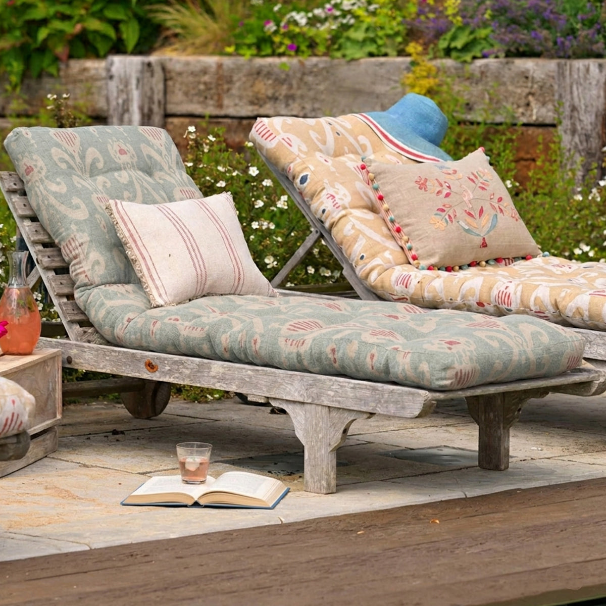 Lounger cushion in floral Natasha fabric on a wooden garden lounger