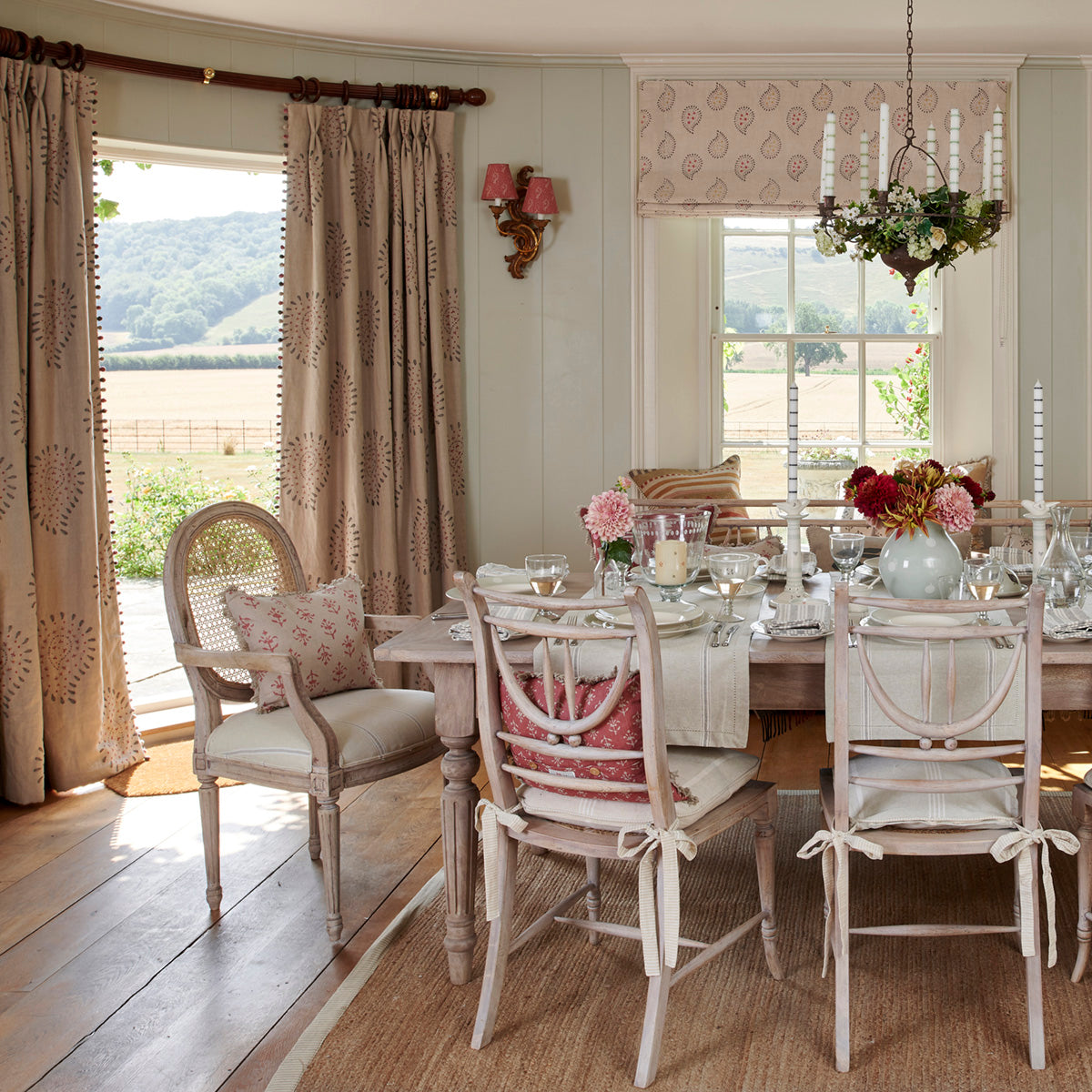 Malathi embroidered curtains in a dining room laid for lunch