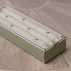 Gold heart dinner candles lined up in their gift box