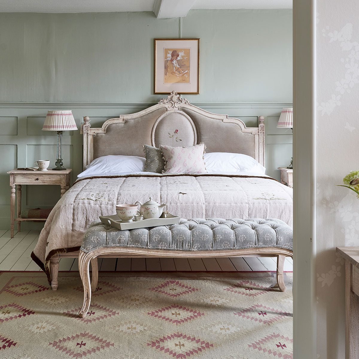 Upholstered Gustavian bed with a buttoned bench at its foot