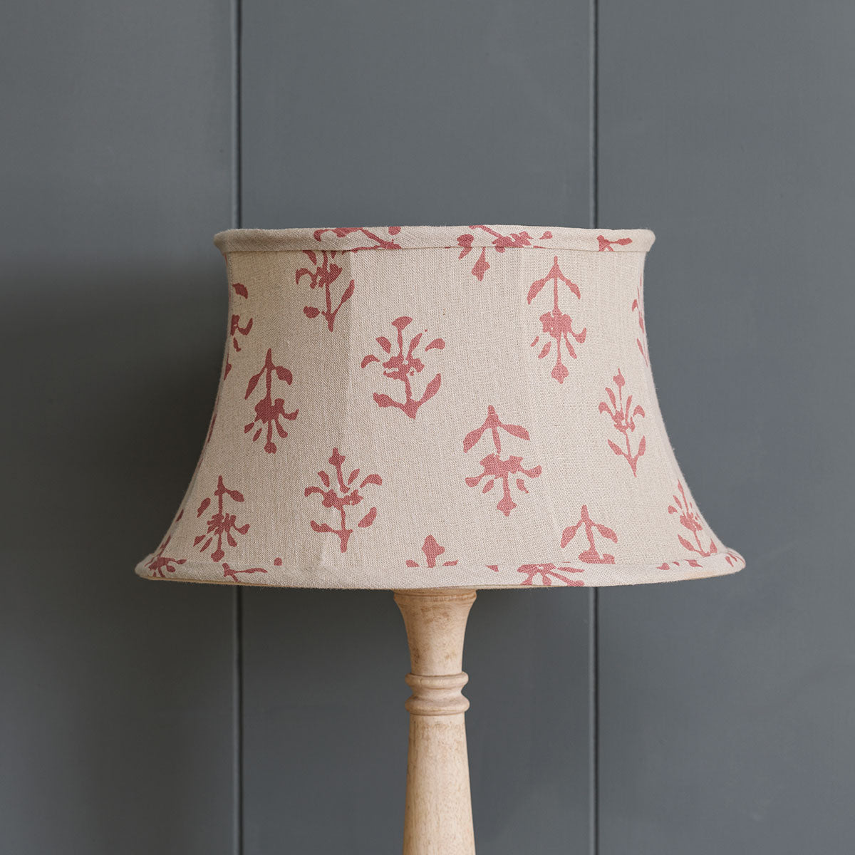 Indian Red Moonflower framed linen lampshade against grey panelling