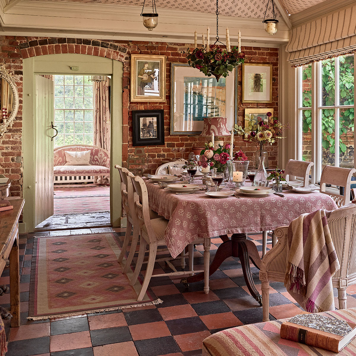 Kilim runner on a tiled floor in a beamed dining room
