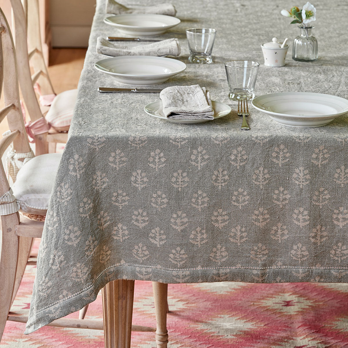 Smokey blue Megha block-print tablecloth on a table laid with plates and glasses