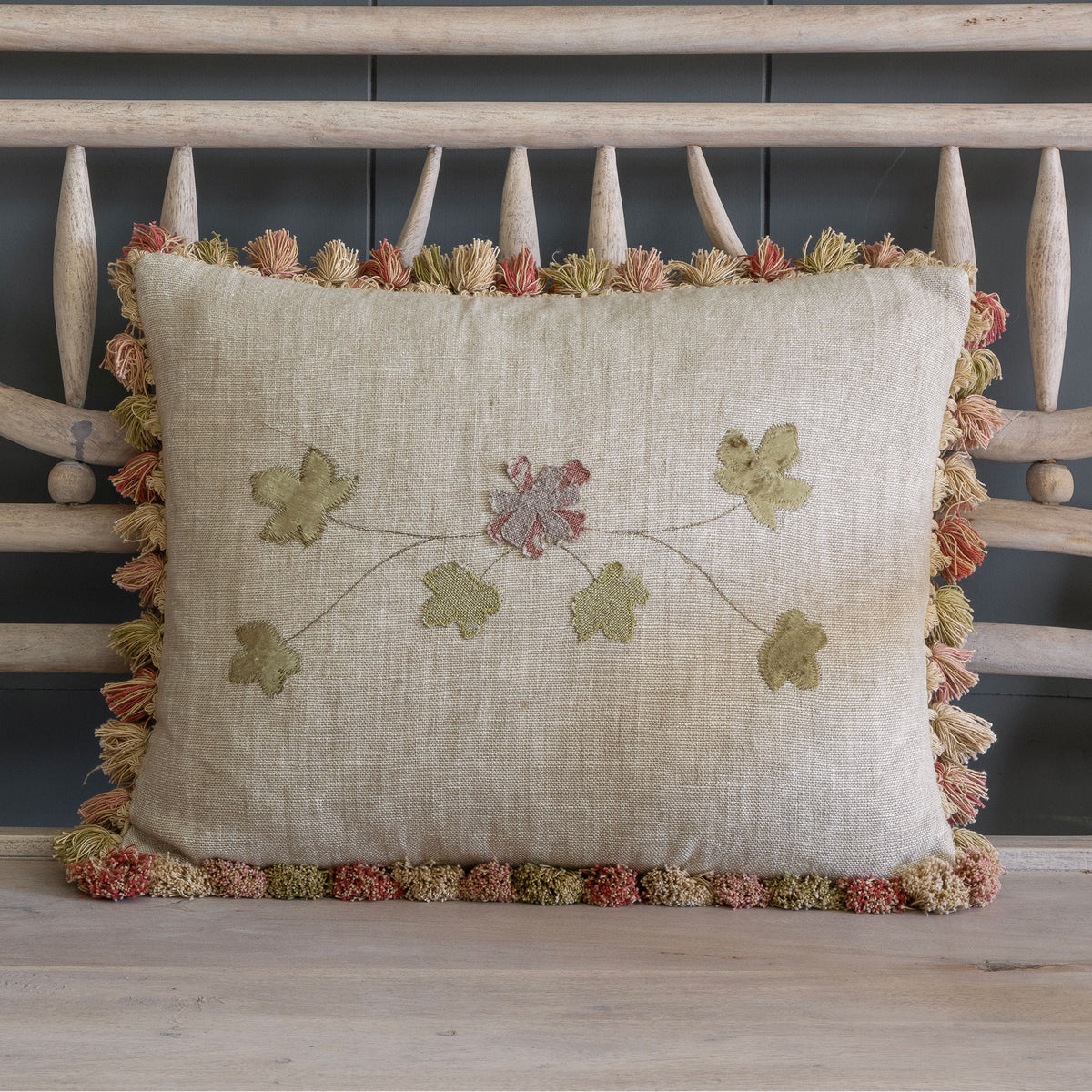 Embroidered Summer Garland cushion on Rustic Linen