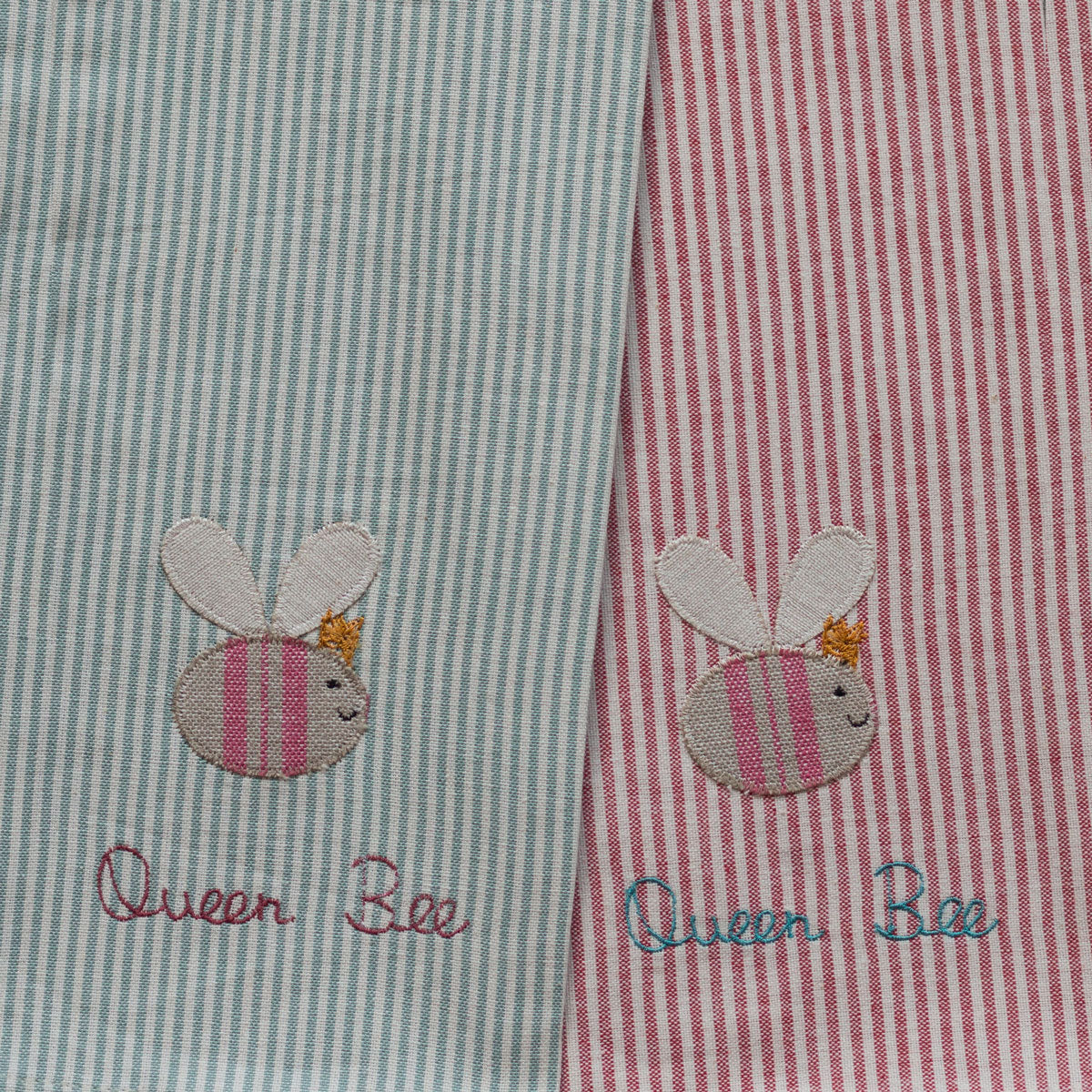 Pair of striped cotton tea towels with appliqued bee and hand-lettered wording