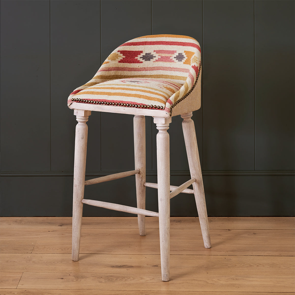 Bar stool in multicoloured striped kilim with a central woven diamond motif