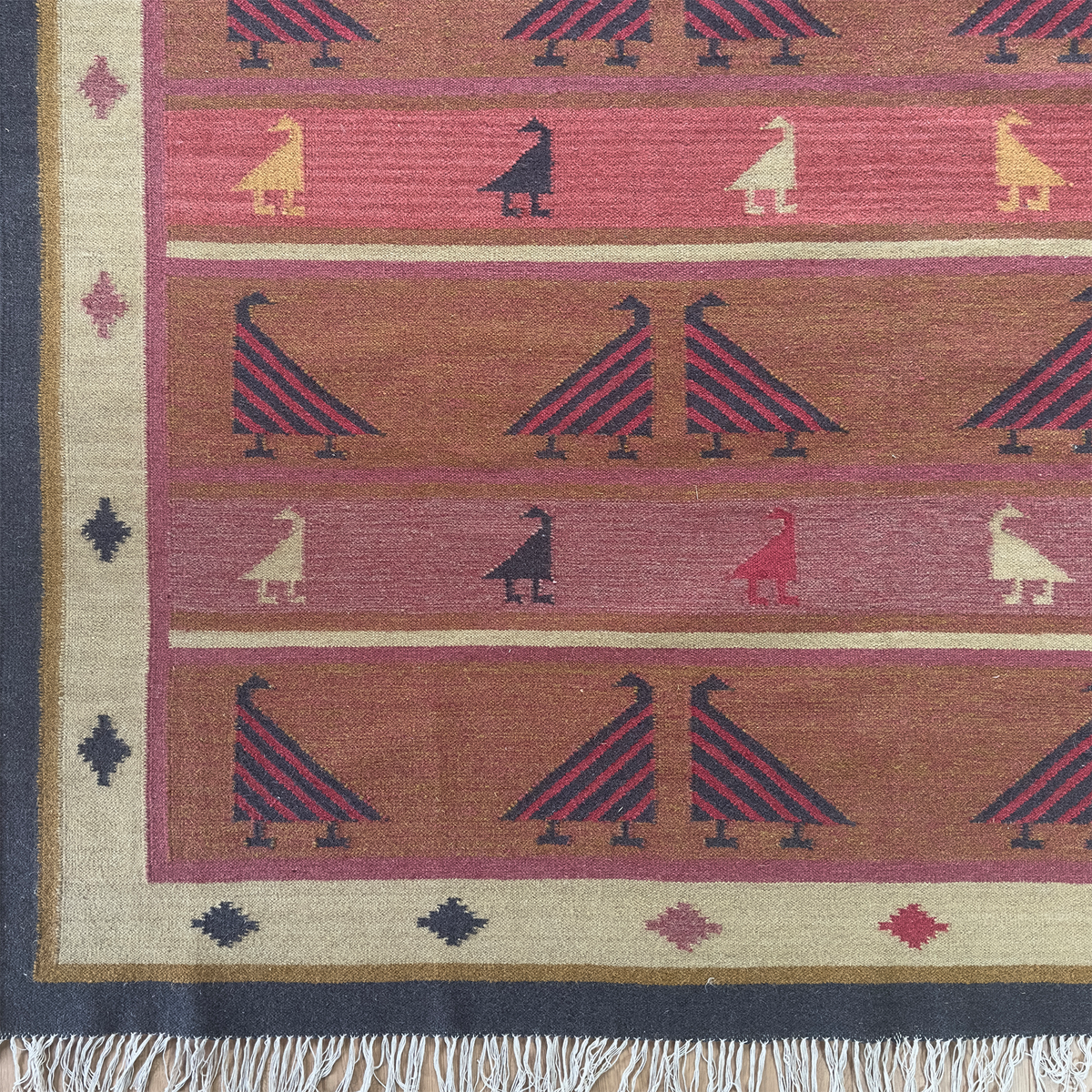 Indian Bird kilim sample with birds walking between pink and red stripes