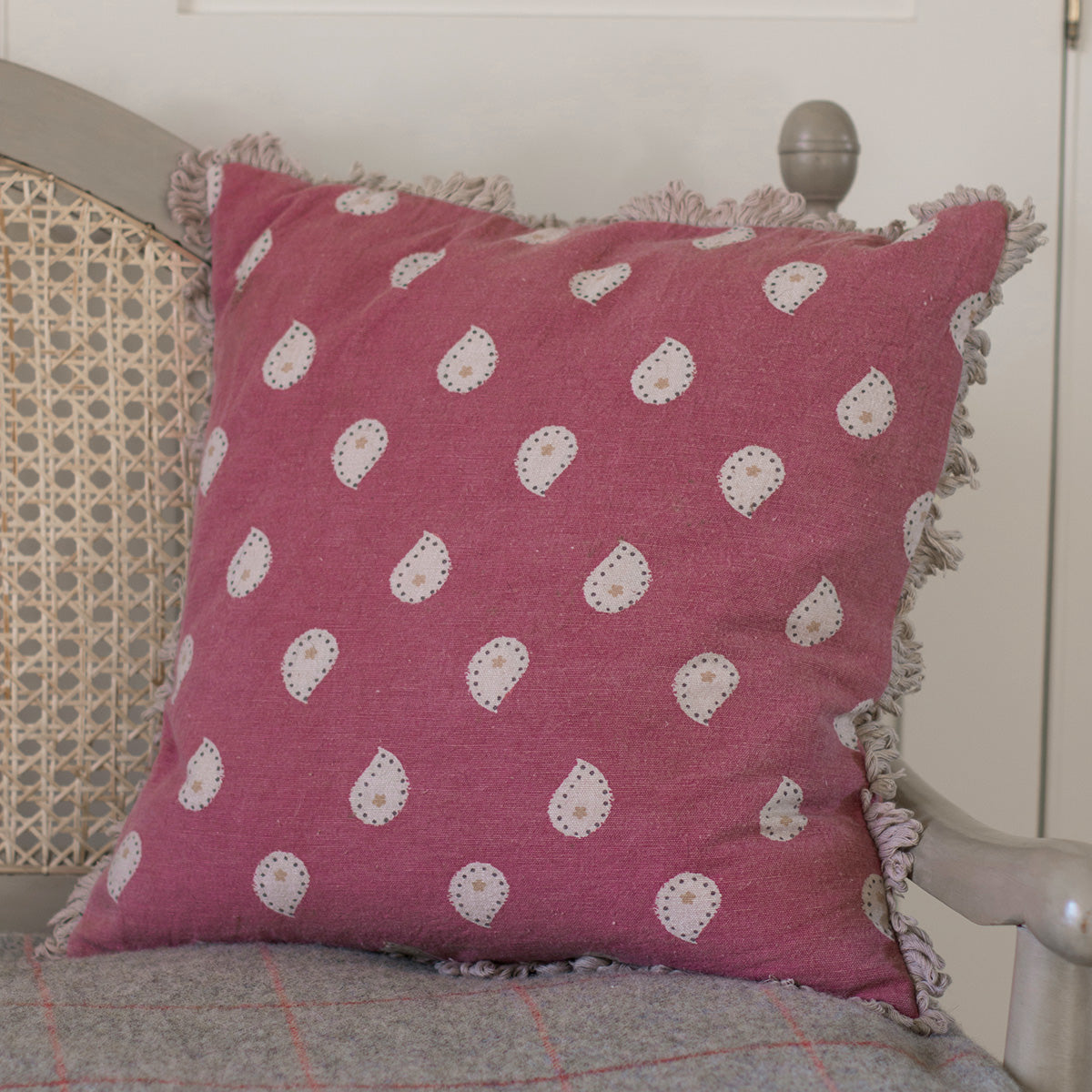 Sail Red Mika cushion with frilled edge on a cane chair