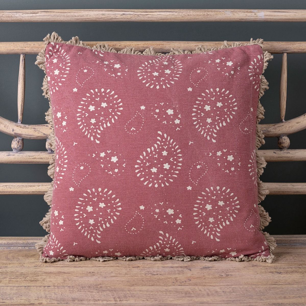 Sail Red Lullaby cushion with frilled edge on a painted bench