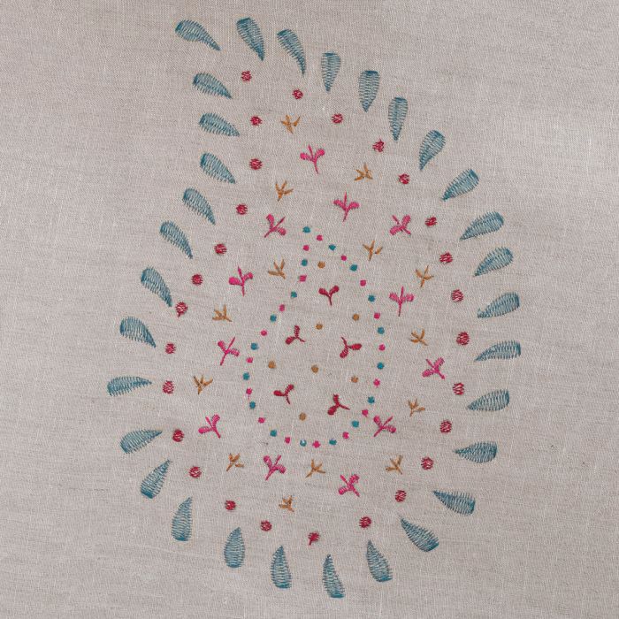 Close detail of the Malathi embroidery on a natural linen ground