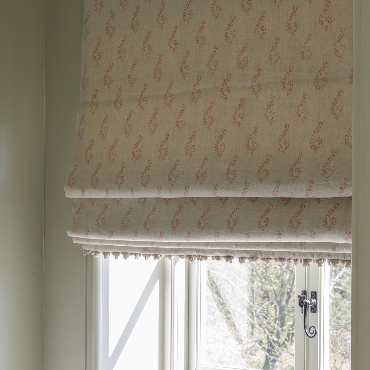 Roman blind made up in Rose Shalini linen at a cottage window
