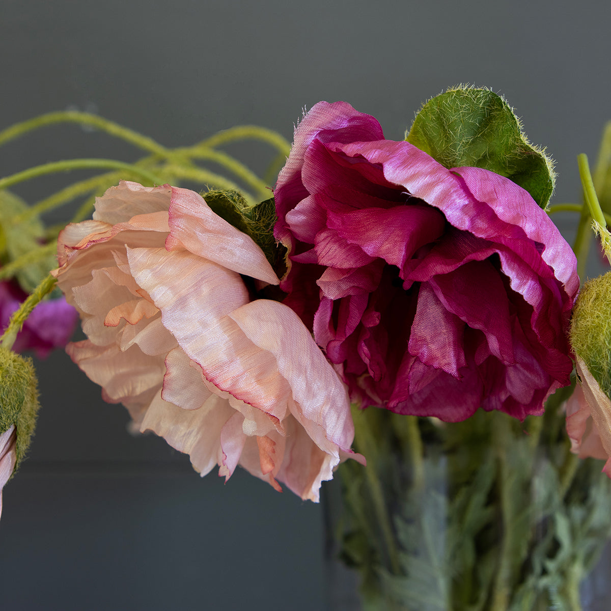 Close view of the pink and magenta faux poppy blooms