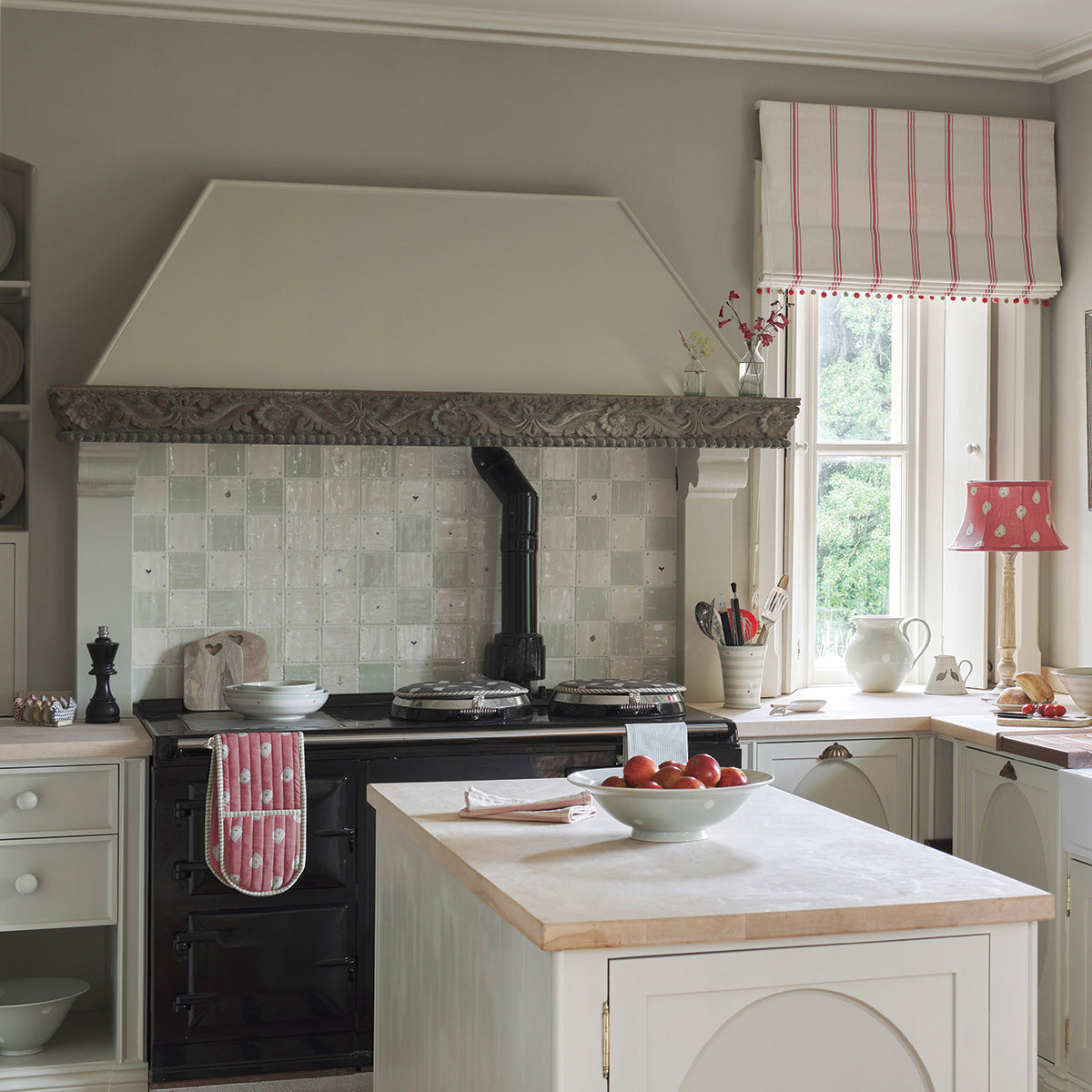 Kitchen with Robin's Egg tiles behind the range and painted units