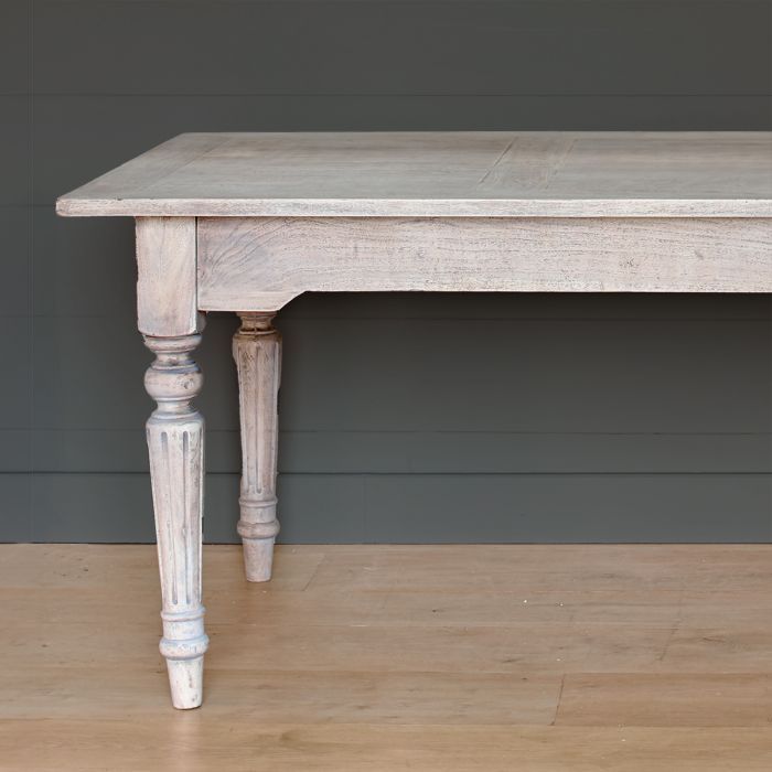 Gustavian dining table in painted wood, photographed plainly