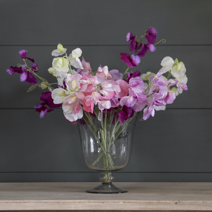 Sweet pea bunch in pink and purple in a glass vase