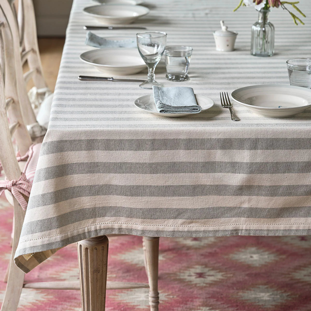 Slate wide stripe tablecloth on a table laid with glasses and jugs